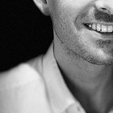 Guido van Beek's portrait with his smile, right cheek and right shoulder